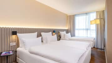 Hypo-allergenic bedding, pillow-top beds, in-room safe, desk