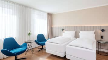 Ropa de cama de alta calidad, colchones con pillow-top y minibar