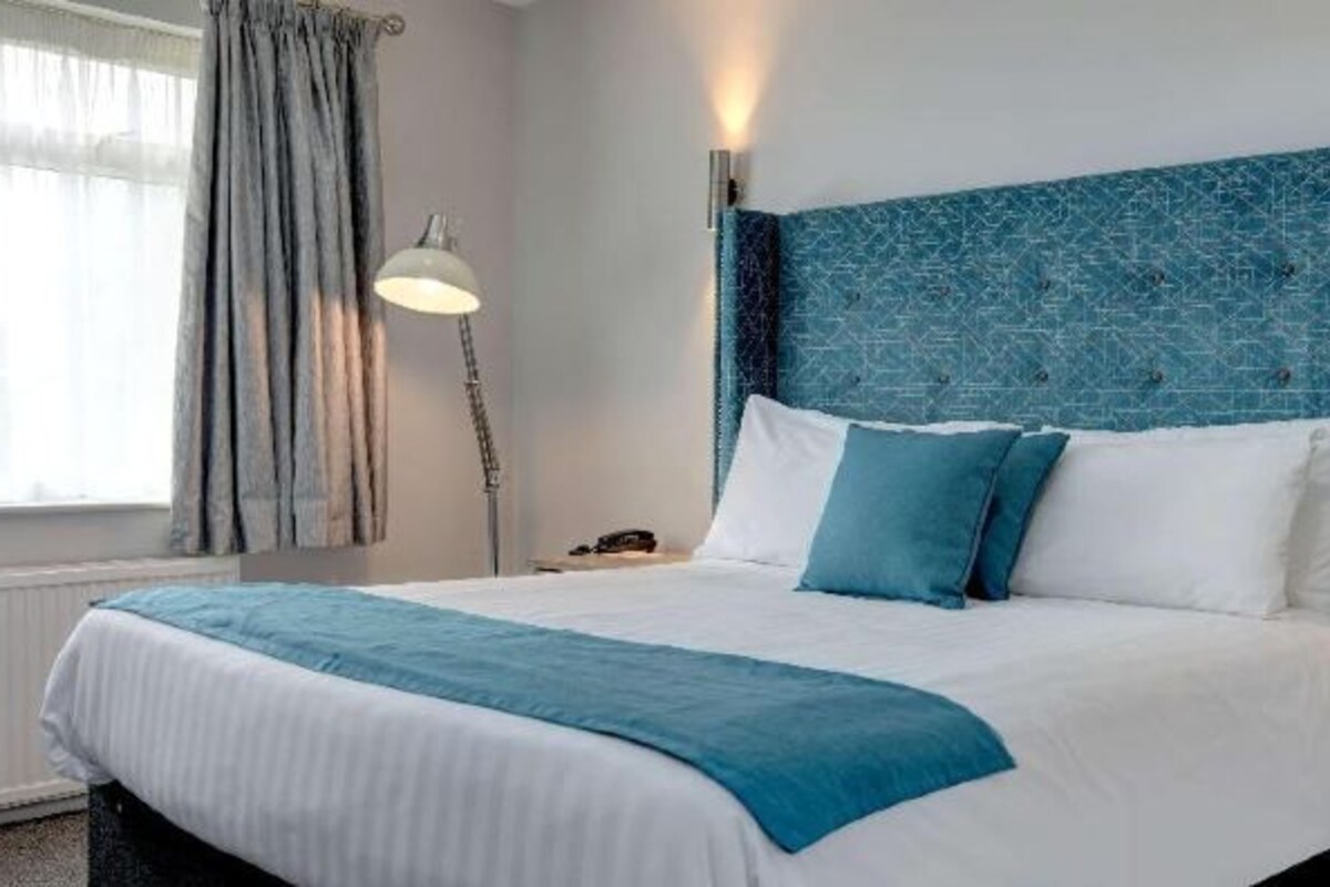 Hypo-allergenic bedding, desk, laptop workspace, iron/ironing board