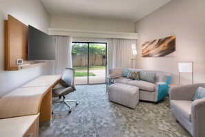 Suite, 1 King Bed with Sofa bed | Living room | Flat-screen TV, pay movies