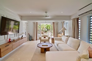 Deluxe Suite (Superior) | Living area | 40-inch LED TV with cable channels, TV, smart speakers