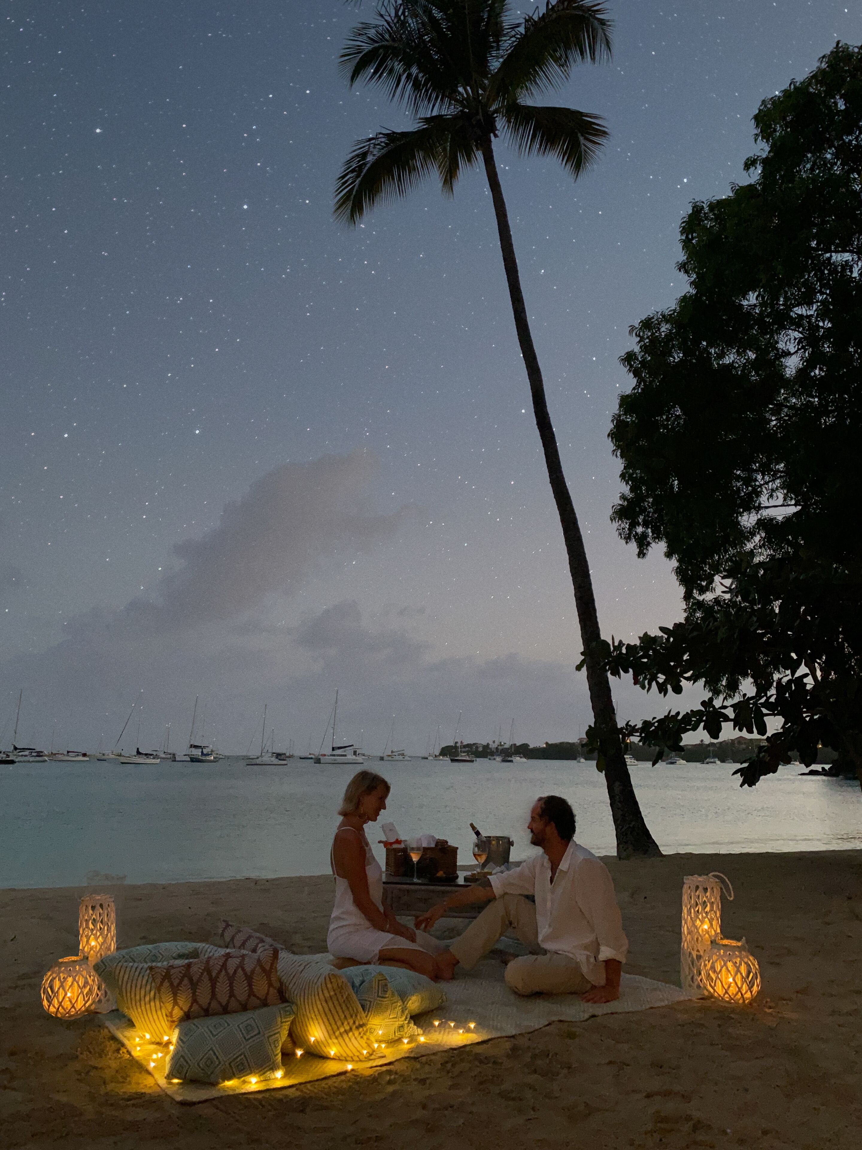 On the beach, white sand, sun-loungers, beach towels