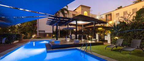 Outdoor pool, open 7:00 AM to 9:00 PM, pool umbrellas, pool loungers