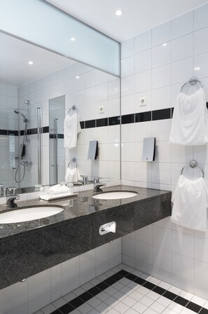 Eco-friendly toiletries, hair dryer, heated floors, towels