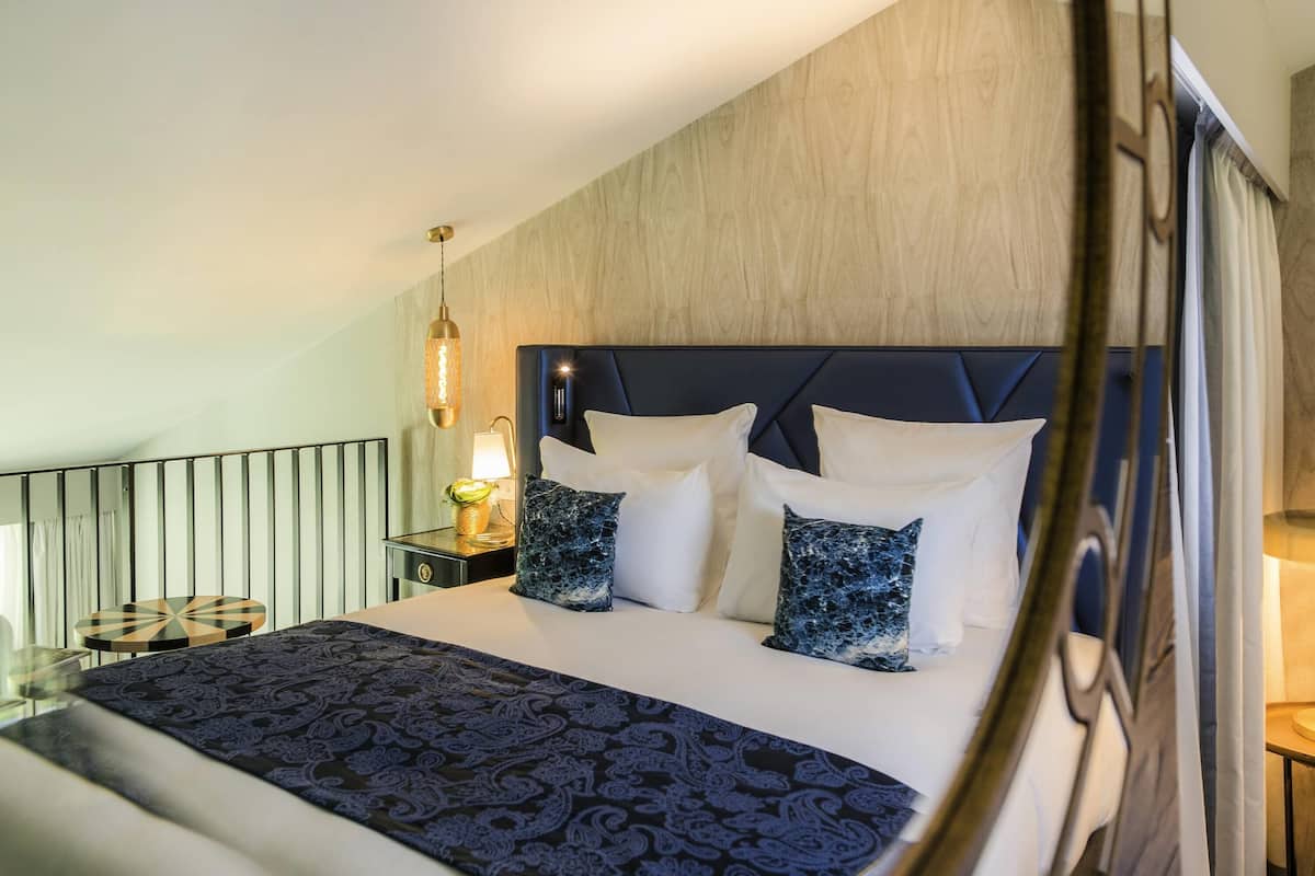 Premium bedding, down comforters, pillowtop beds, minibar