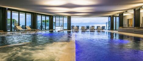 Luxe beddengoed, donsdekens, pillowtop-bedden, een minibar