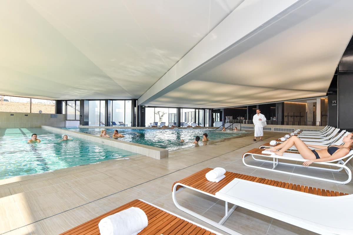 Premium bedding, down comforters, pillowtop beds, minibar