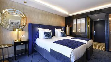 Luxe beddengoed, donsdekens, pillowtop-bedden, een minibar