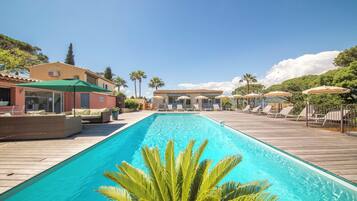 Seasonal outdoor pool, pool loungers