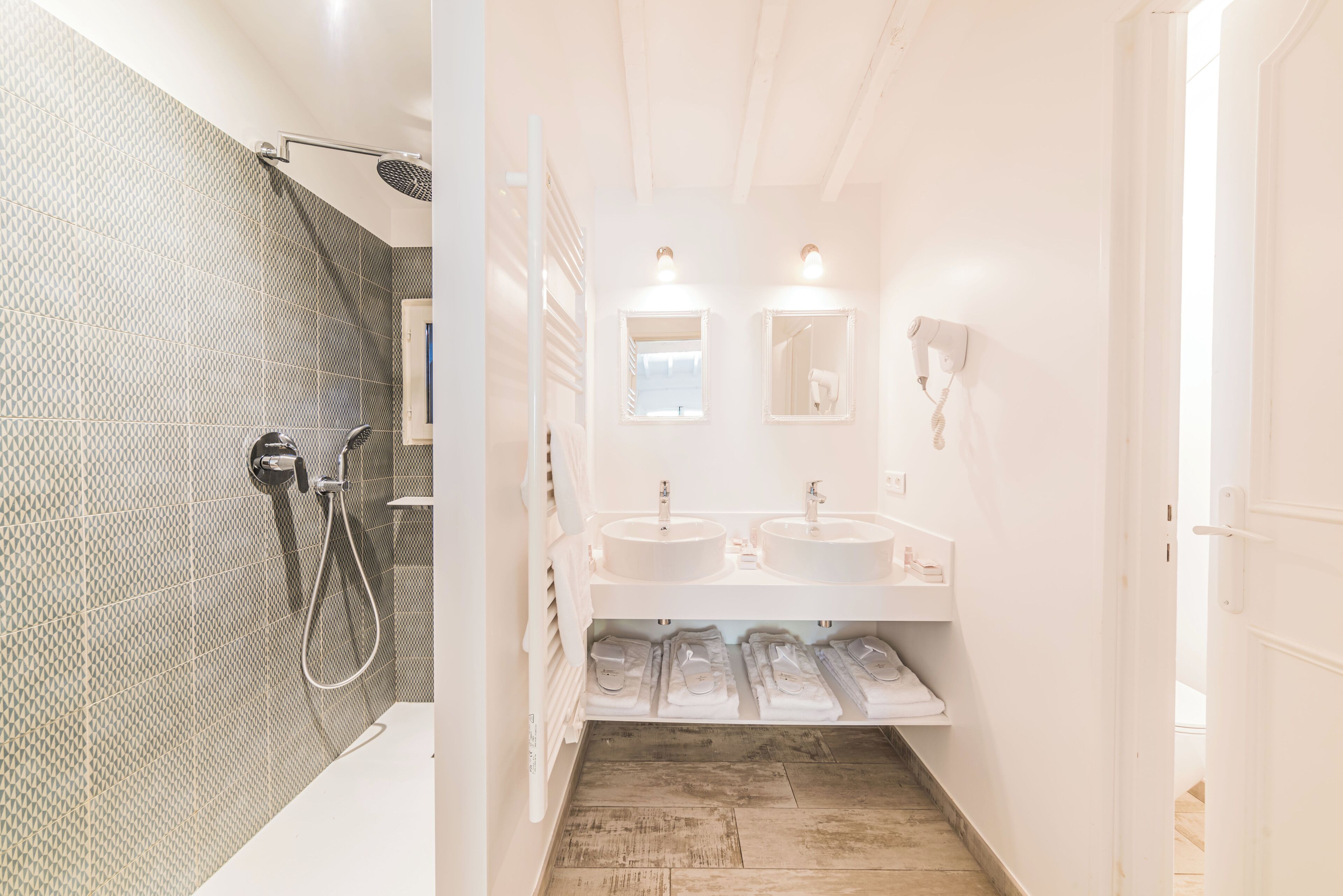 family room | bathroom | shower, rainfall showerhead, hair dryer, towels