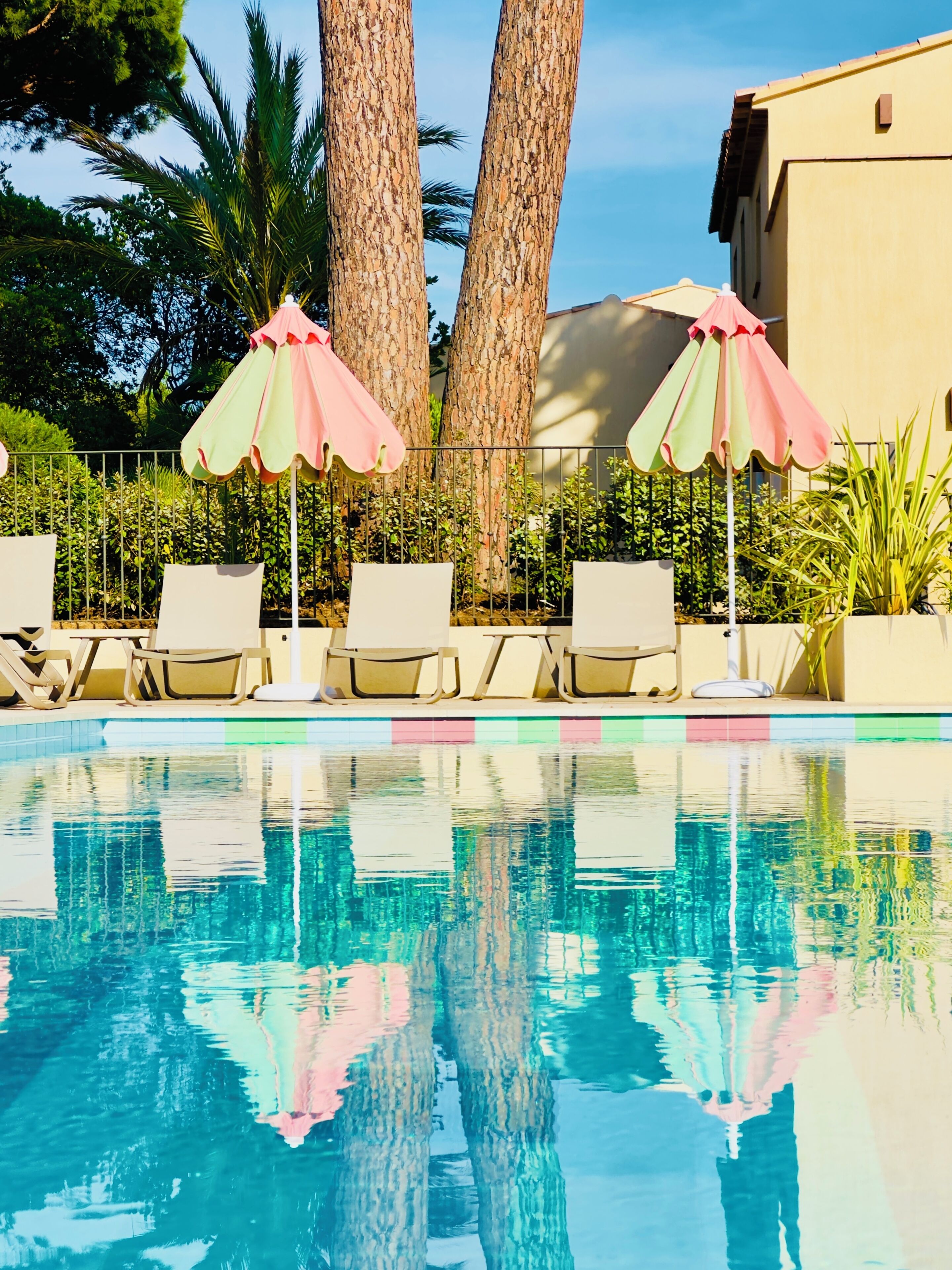 Seasonal outdoor pool, open 8:00 AM to 10:00 PM, pool umbrellas