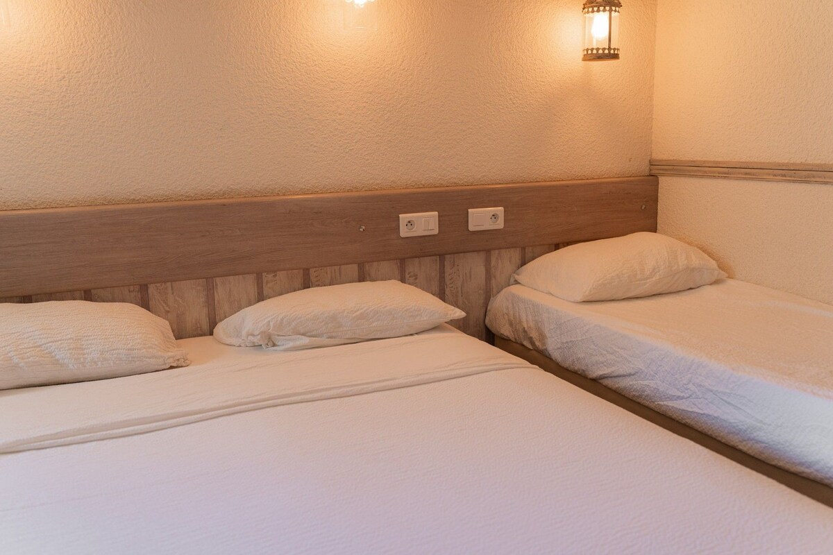 Triple Room | Desk, blackout drapes, WiFi (free), individually decorated