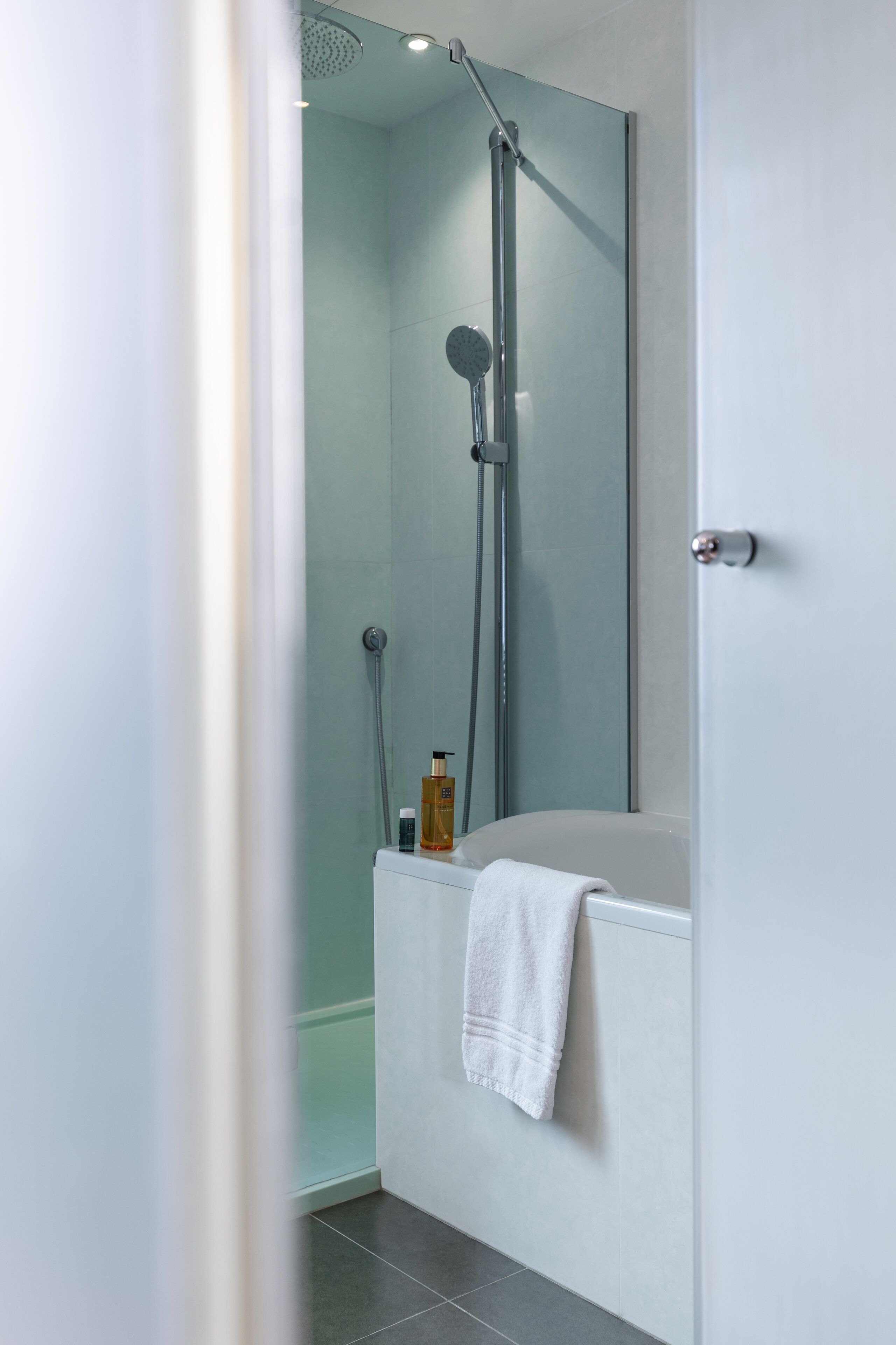 connecting family room | bathroom | shower, free toiletries, hair dryer, towels