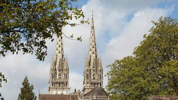 A Gothic-style church with two tall spires and intricate stonework.