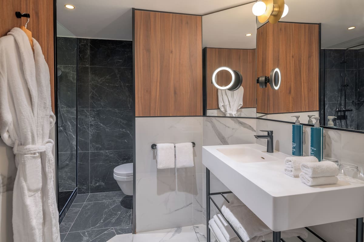 bathtub, free toiletries, hair dryer, bathrobes