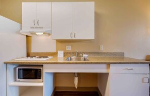 Full-size fridge, microwave, stovetop, coffee/tea maker