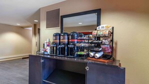 A coffee station with multiple coffee makers and a variety of coffee pods. - Extended Stay America Suites Great Falls Missouri River (Great Falls)