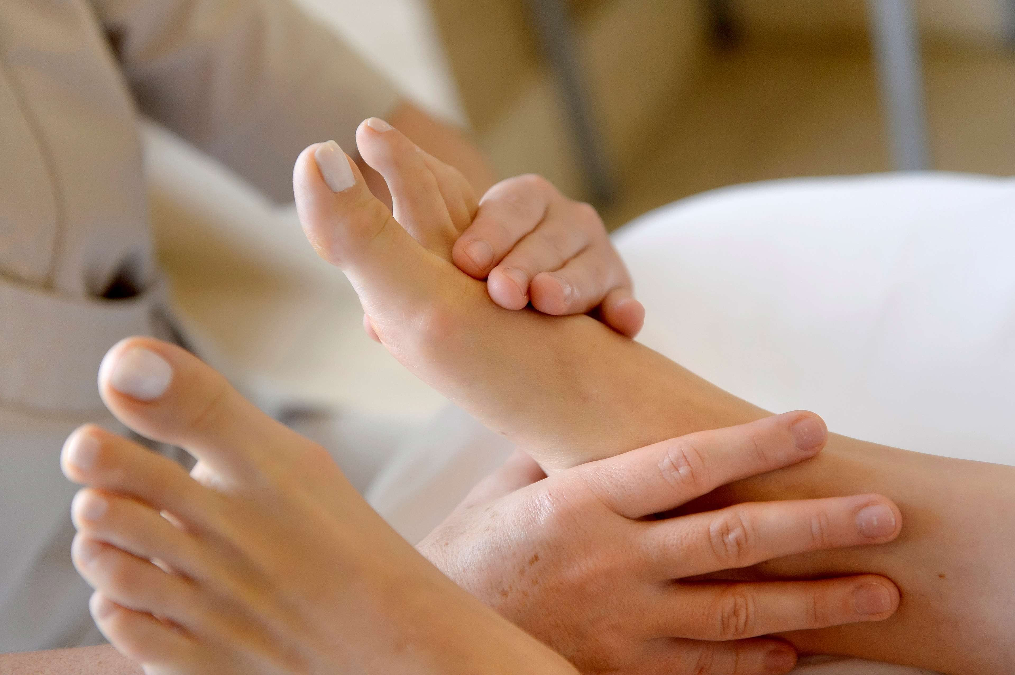 A foot massage being performed.