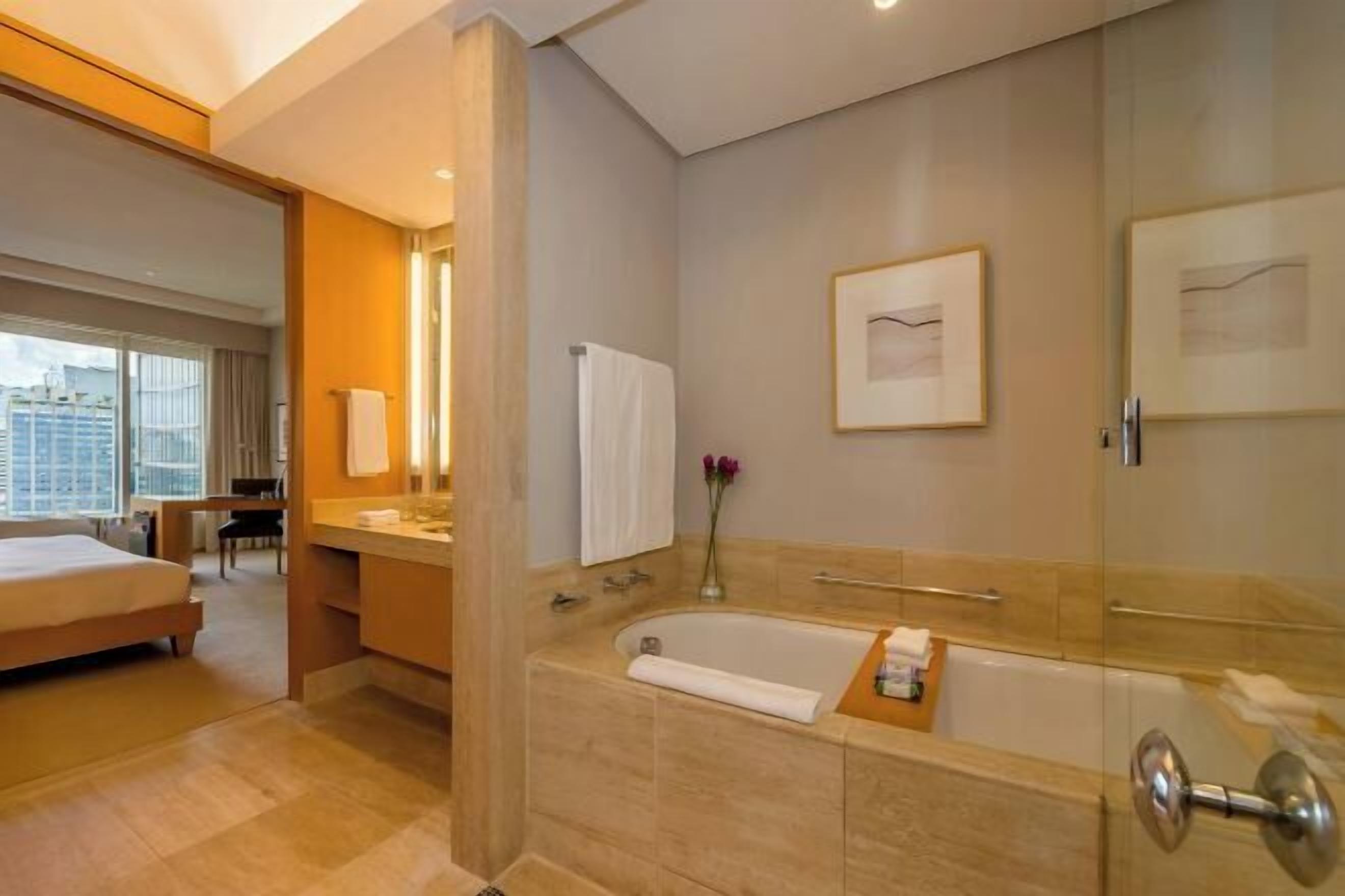 Separate tub and shower, designer toiletries, hair dryer, bathrobes