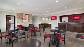 Experience a welcoming atmosphere in our lobby, featuring a digital display, comfortable seating, and elegant design.