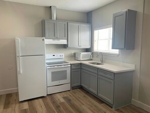 Desk, blackout drapes, iron/ironing board, cribs (free)
