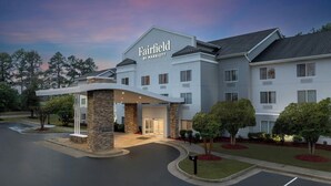 A Fairfield by Marriott hotel with a modern design, featuring a prominent entrance and a well-maintained lawn.