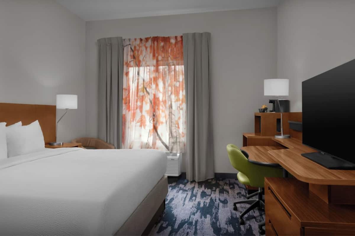 Premium bedding, pillow-top beds, desk, laptop workspace