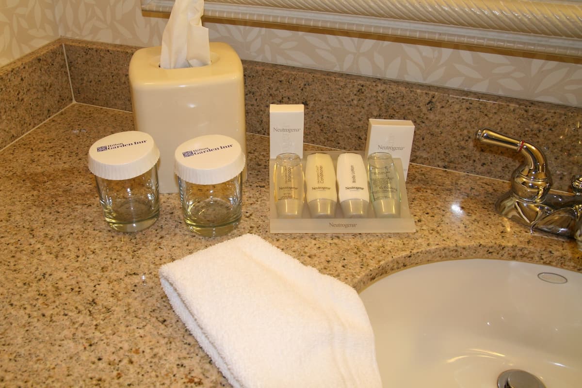 bathtub, free toiletries, hair dryer, towels