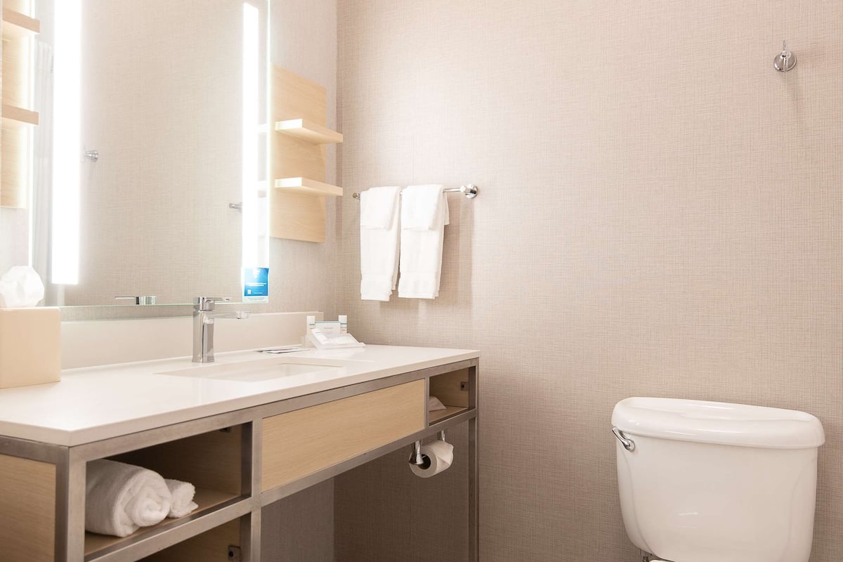 one king bed | bathroom | free toiletries, hair dryer, towels, soap