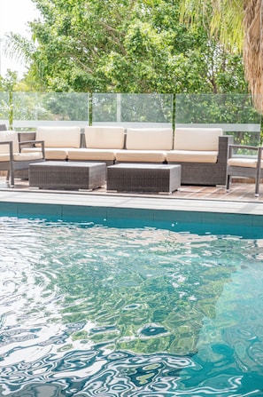 Indoor pool, open 8:00 AM to 9:00 PM, pool loungers
