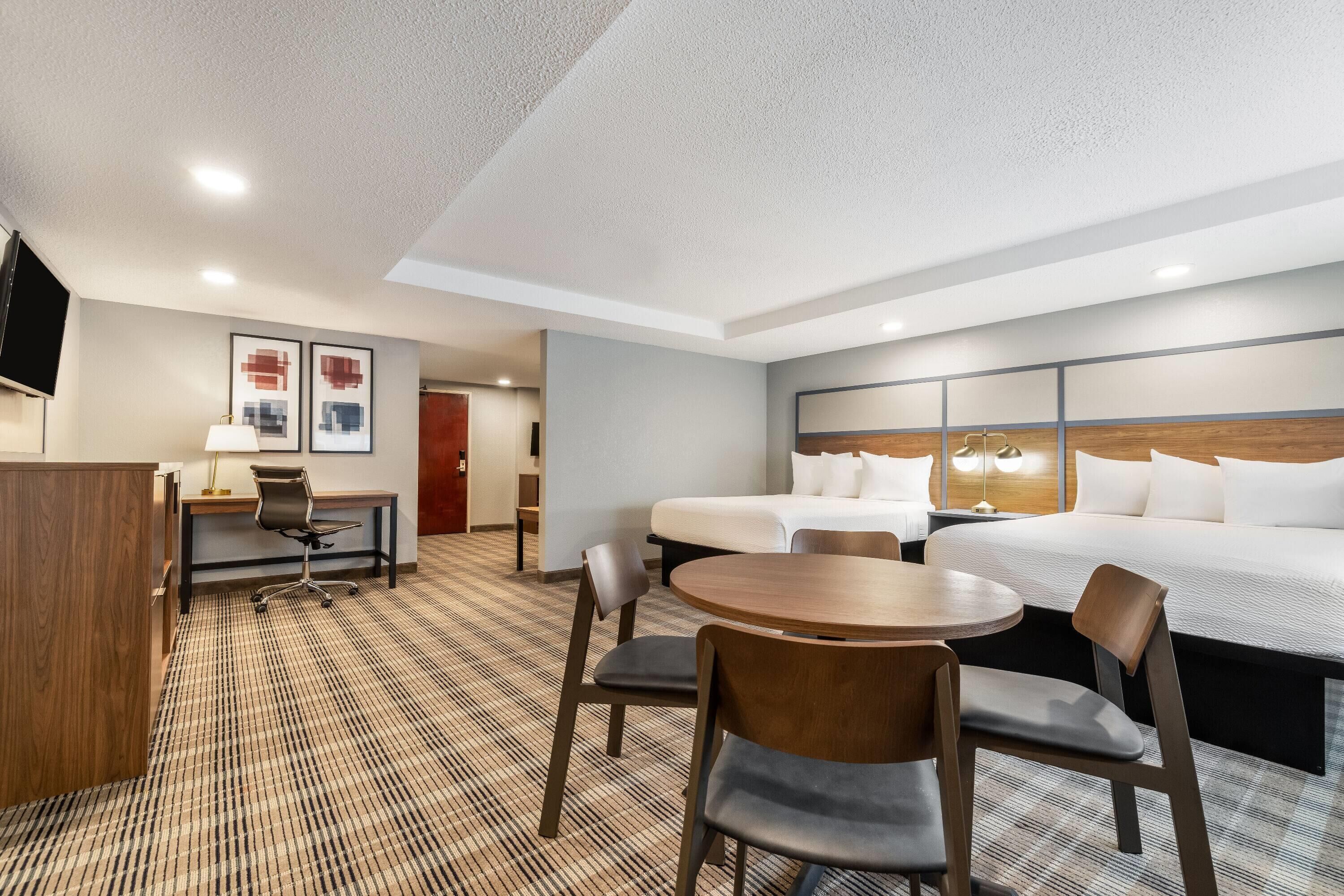 Premier Suite, 2 Queen Beds, Non Smoking | Desk, blackout drapes, iron/ironing board, free cribs/infant beds