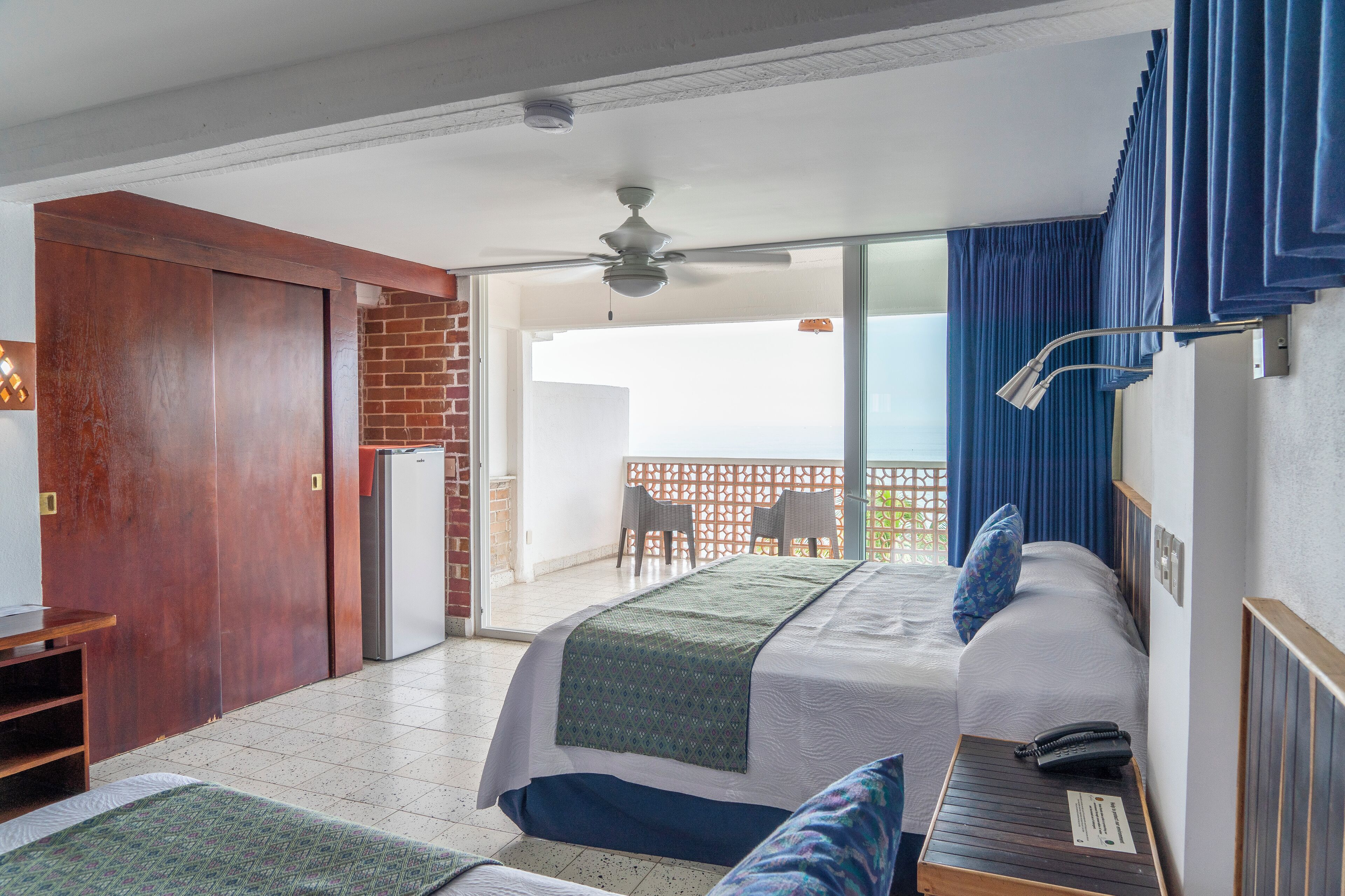 superior room, ocean view | premium bedding, in-room safe, desk, iron/ironing board