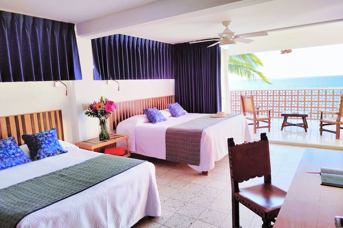 superior room, ocean view | premium bedding, in-room safe, desk, iron/ironing board