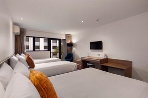 A hotel room with two beds, a desk, a chair, a TV, and a window with curtains. - Sudima Christchurch Airport (Christchurch)