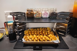 A buffet table with a variety of food items and condiments. - Sudima Christchurch Airport (Christchurch)