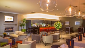 A modern lounge area with sofas, tables, and a bar. - Sudima Christchurch Airport (Christchurch)