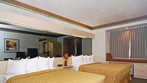 A hotel room with two beds, a large mirror, a television, and a window with curtains. - Motel 6 Bernalillo, NM (Bernalillo)