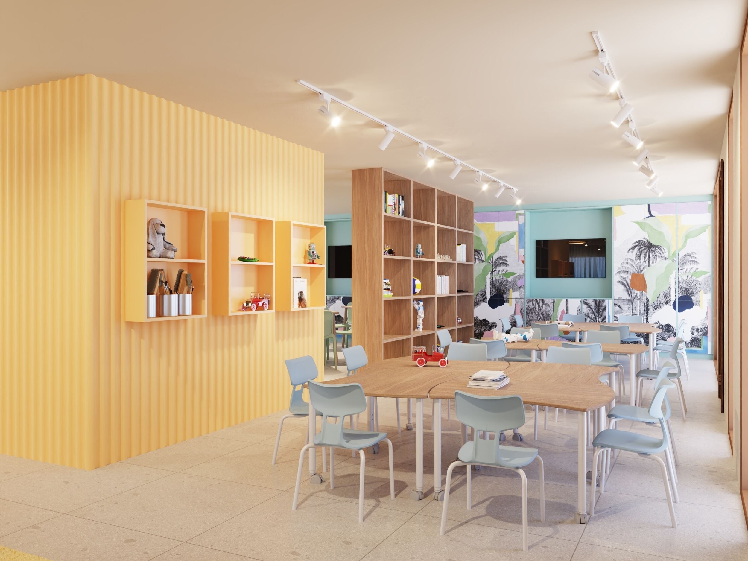 Una sala de jocs infantil moderna amb un gran taulell de fusta, diverses cadires i prestatges integrats plens de joguines i llibres.