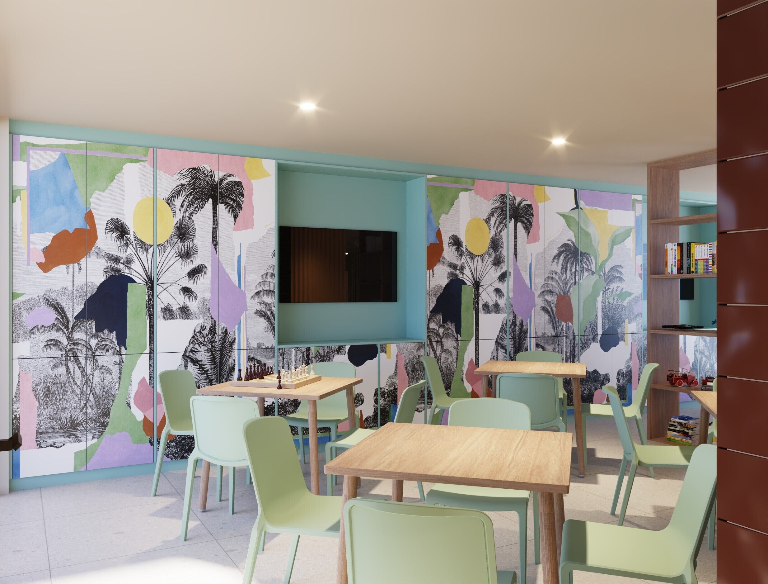 Une salle de jeux pour enfants avec des œuvres d’art abstraites et colorées sur les murs, un téléviseur à écran plat, ainsi que plusieurs tables et chaises.