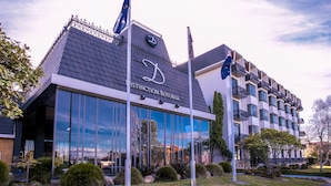 A modern building with a distinctive roof and large windows, labeled "DISTINCTION ROYAL." - Distinction Rotorua Hotel and Conference Centre (Rotorua)