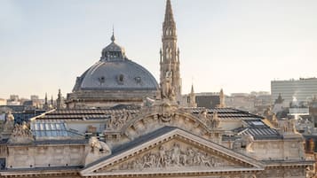A grand building with intricate sculptures and a prominent dome.