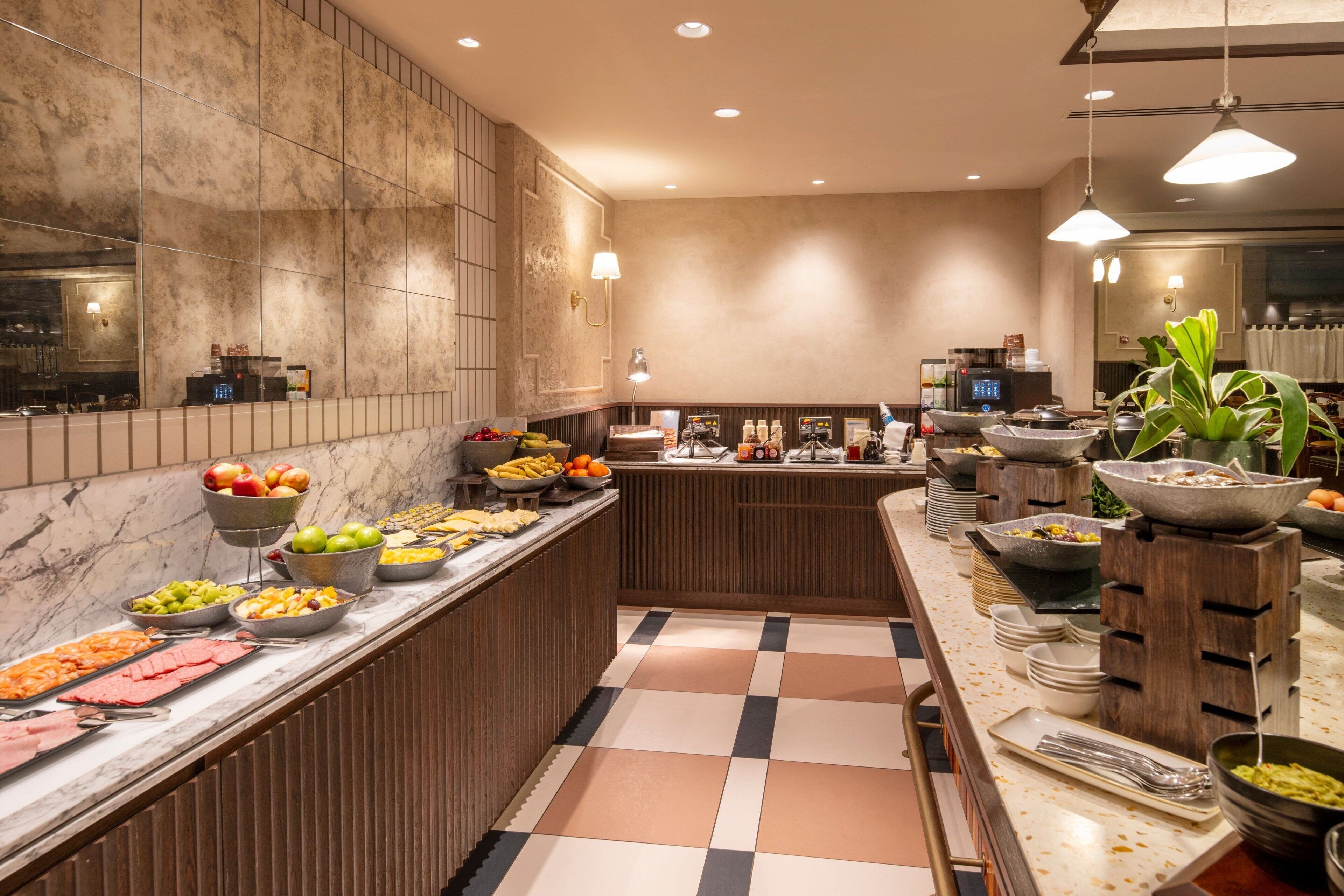 A buffet with various food items and a check-in counter.