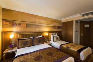 Triple room | Premium bedding, minibar, in-room safe, individually decorated