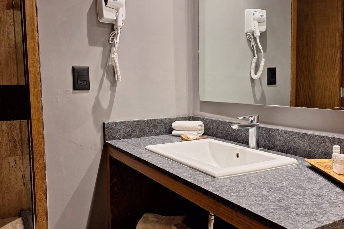 superior double room | bathroom | shower, hair dryer, towels, soap