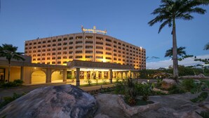 A large, multi-story hotel with a prominent entrance and a well-lit facade. - Dar Es Salaam Serena Hotel (Dar es Salaam)