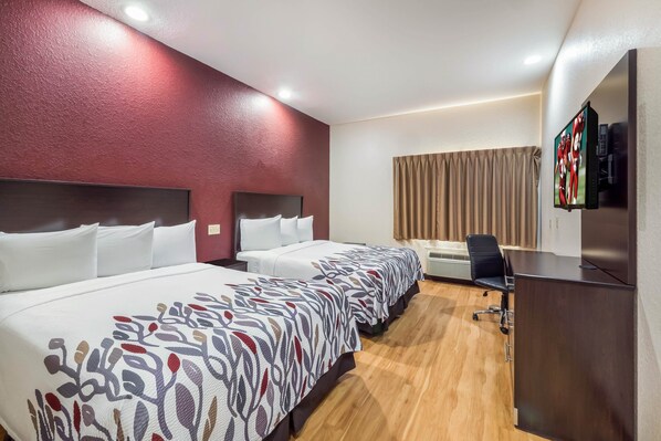 Desk, laptop workspace, blackout drapes, free cribs/infant beds