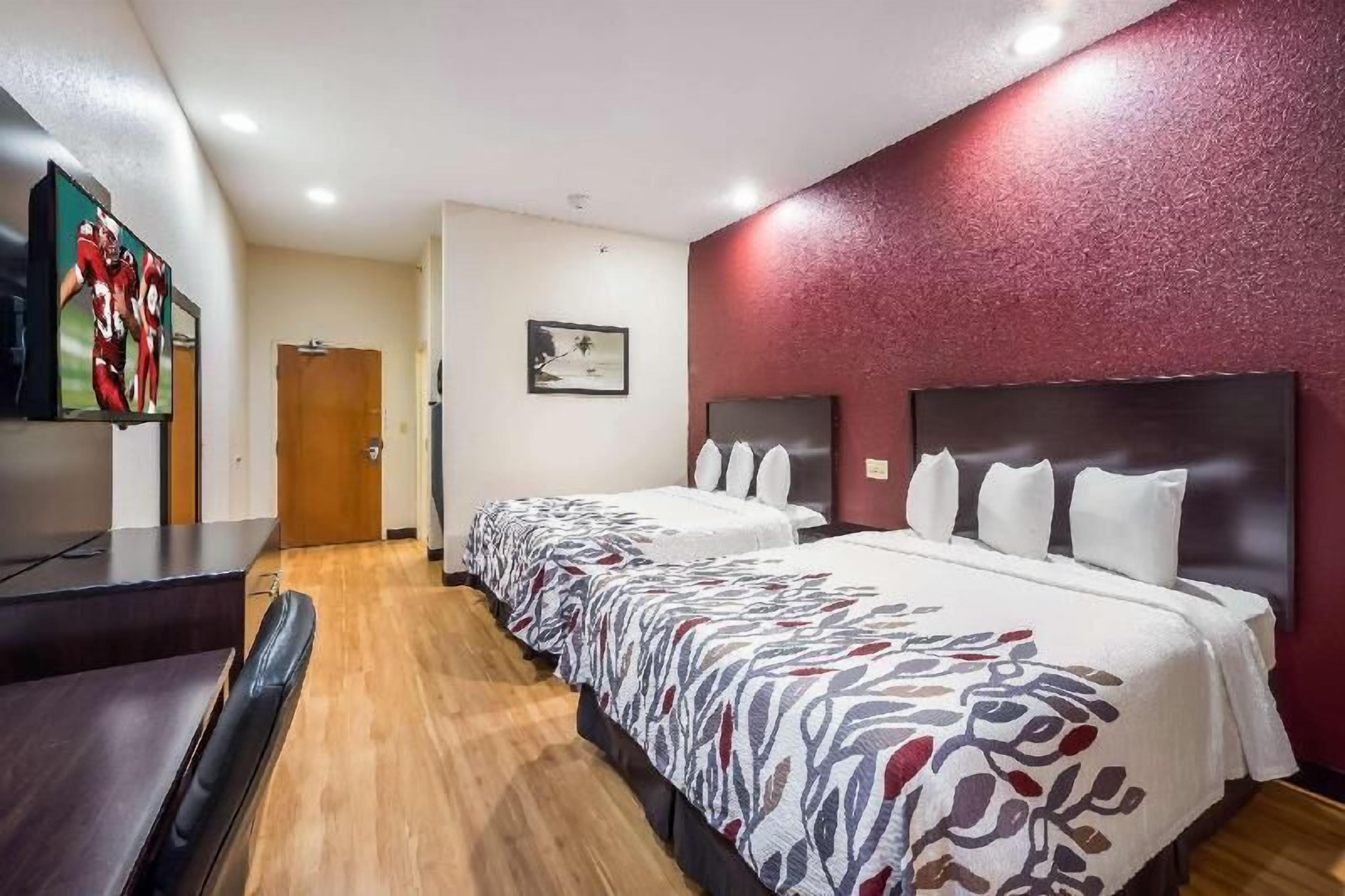 Desk, laptop workspace, blackout drapes, free cribs/infant beds