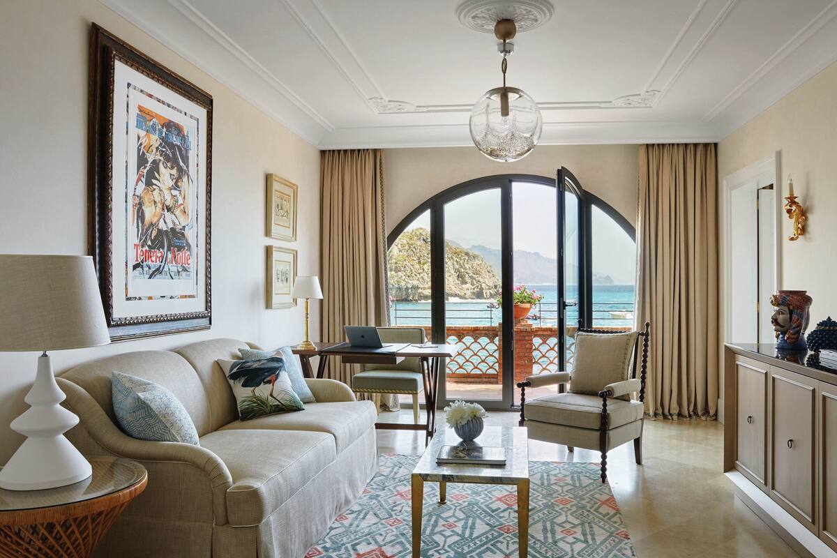 suite (mare) | living area | 42-inch led tv with digital channels, tv, dvd player