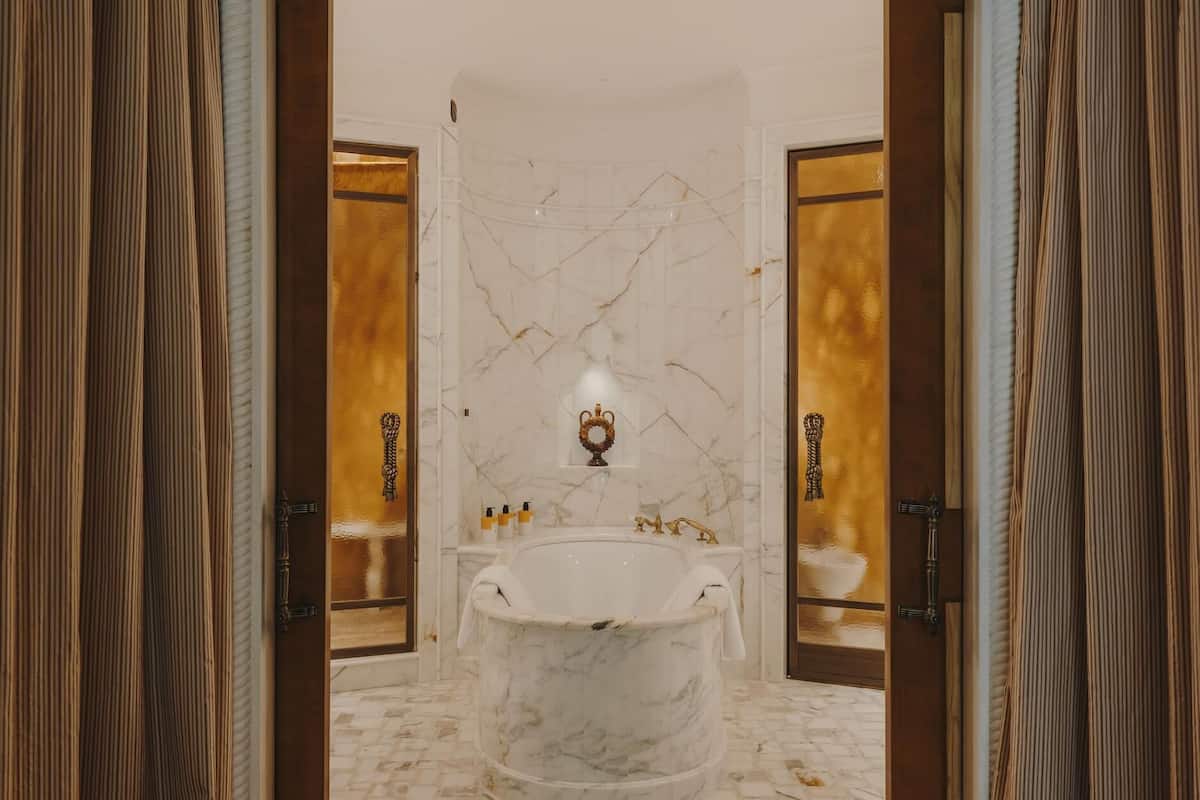 junior suite (villa timeo) | bathroom | rainfall showerhead, hair dryer, bathrobes, slippers
