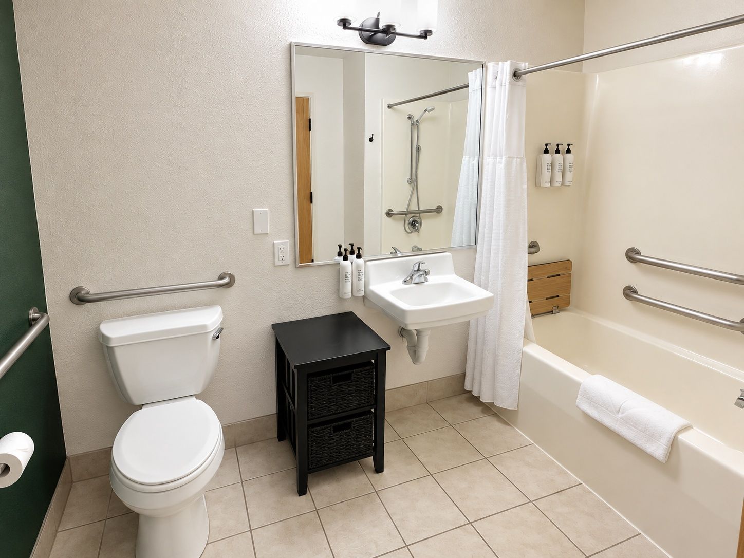 A bathroom with a toilet, sink, and bathtub.